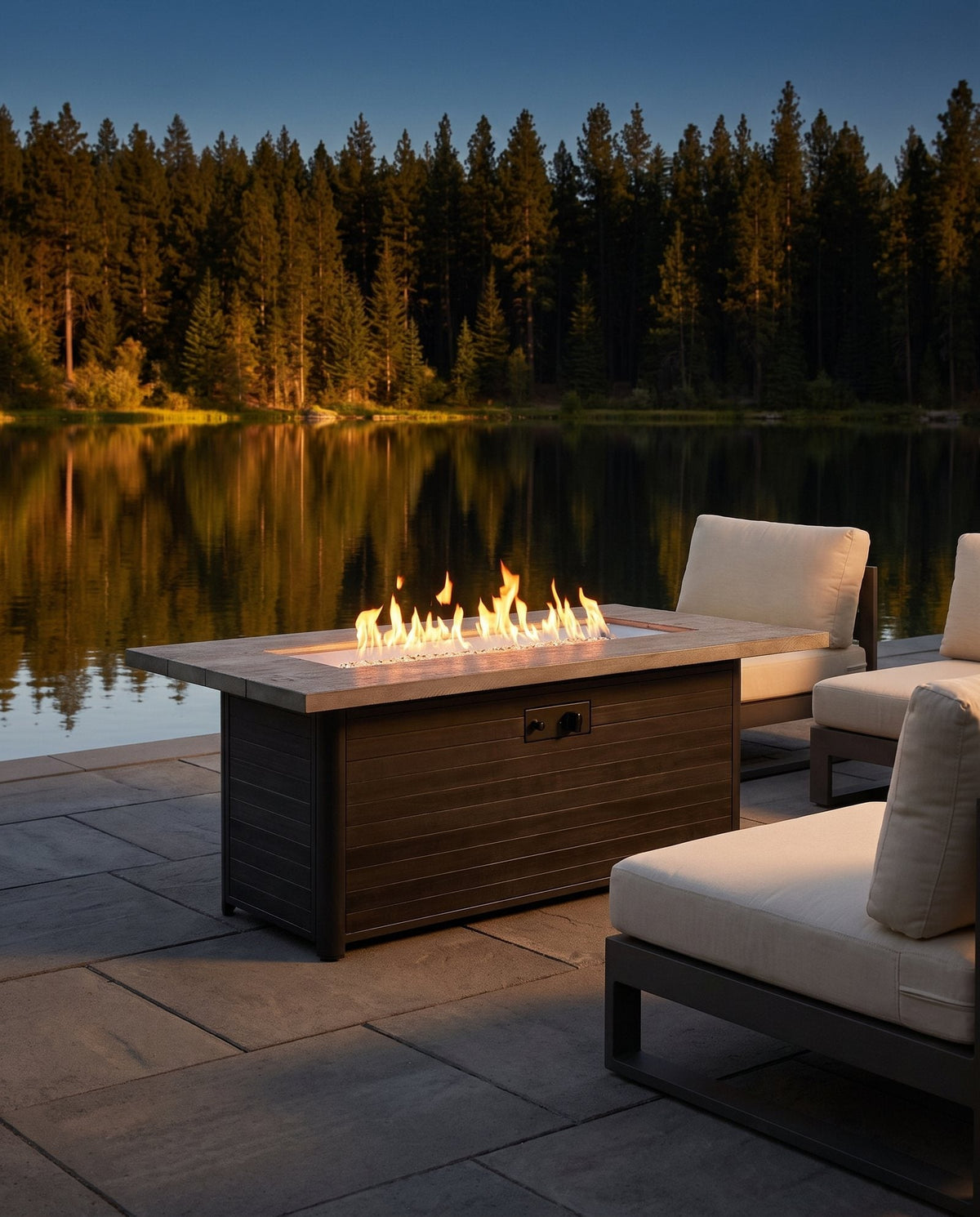 Outdoor GreatRoom Cedar Ridge linear gas fire table lit on an outdoor patio