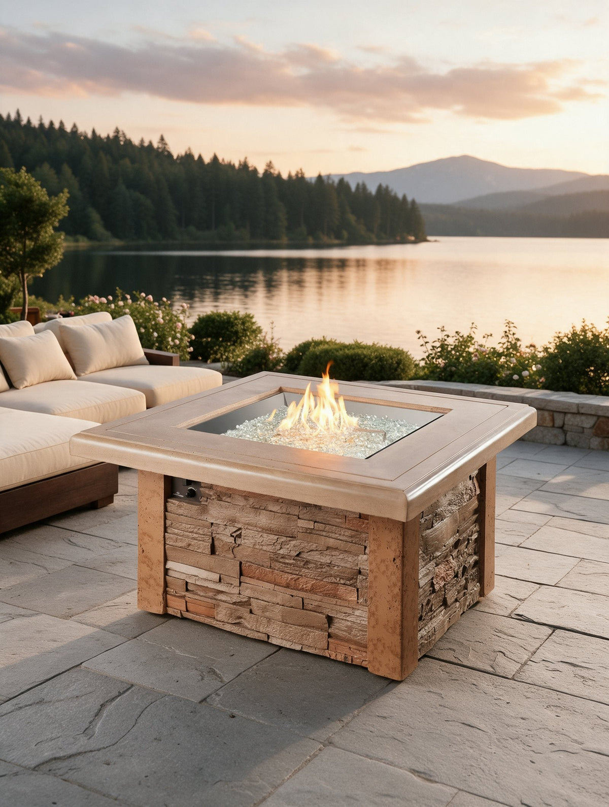 Outdoor GreatRoom Sierra square gas fire pit table lit on an outdoor patio